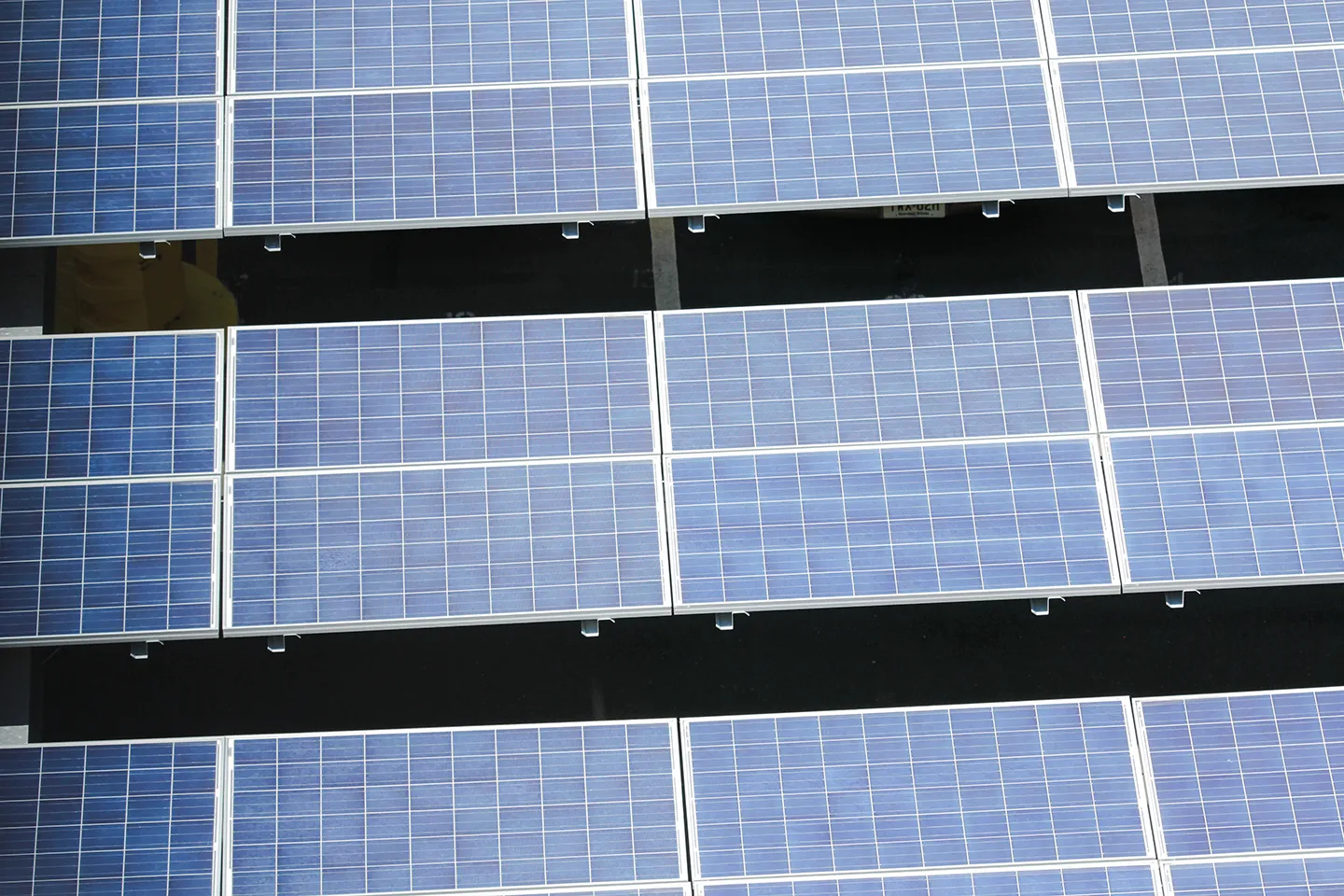 Transitioning to renewable energy systems, such as solar, wind, or geothermal, significantly reduces carbon emissions from buildings and infrastructure.