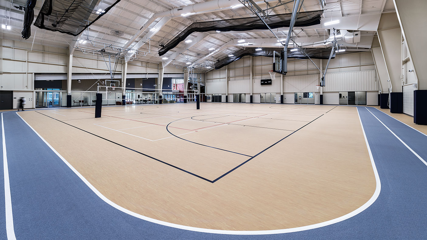 The fieldhouse incorporates a suspended batting cage and divider curtains along with the ability to add another basketball/volleyball court in the future. 