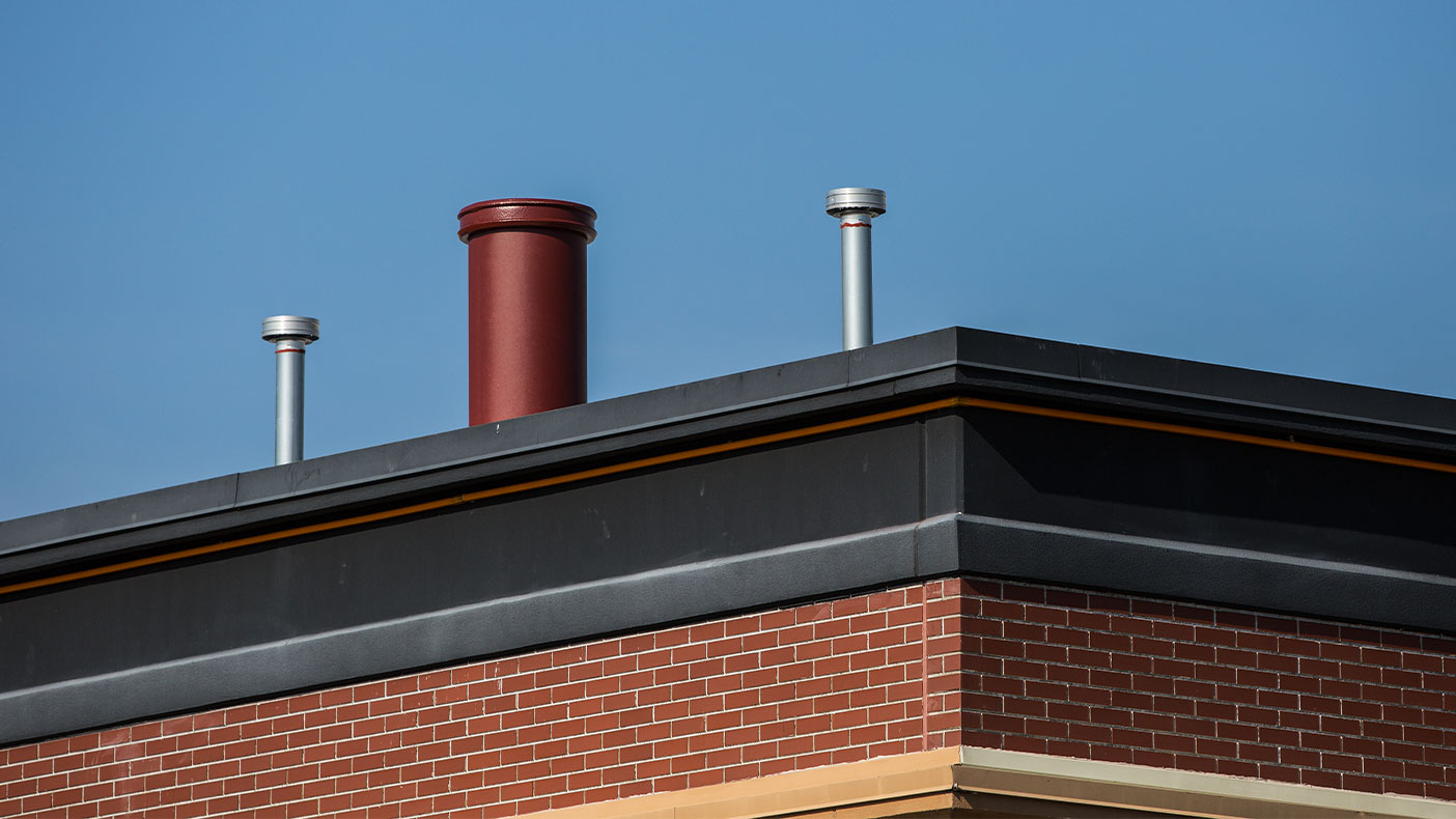 To maintain aesthetics, a stove pipe made of RF transparent material was mounted on the antenna and painted to match the existing building architecture, which also concealed the equipment.