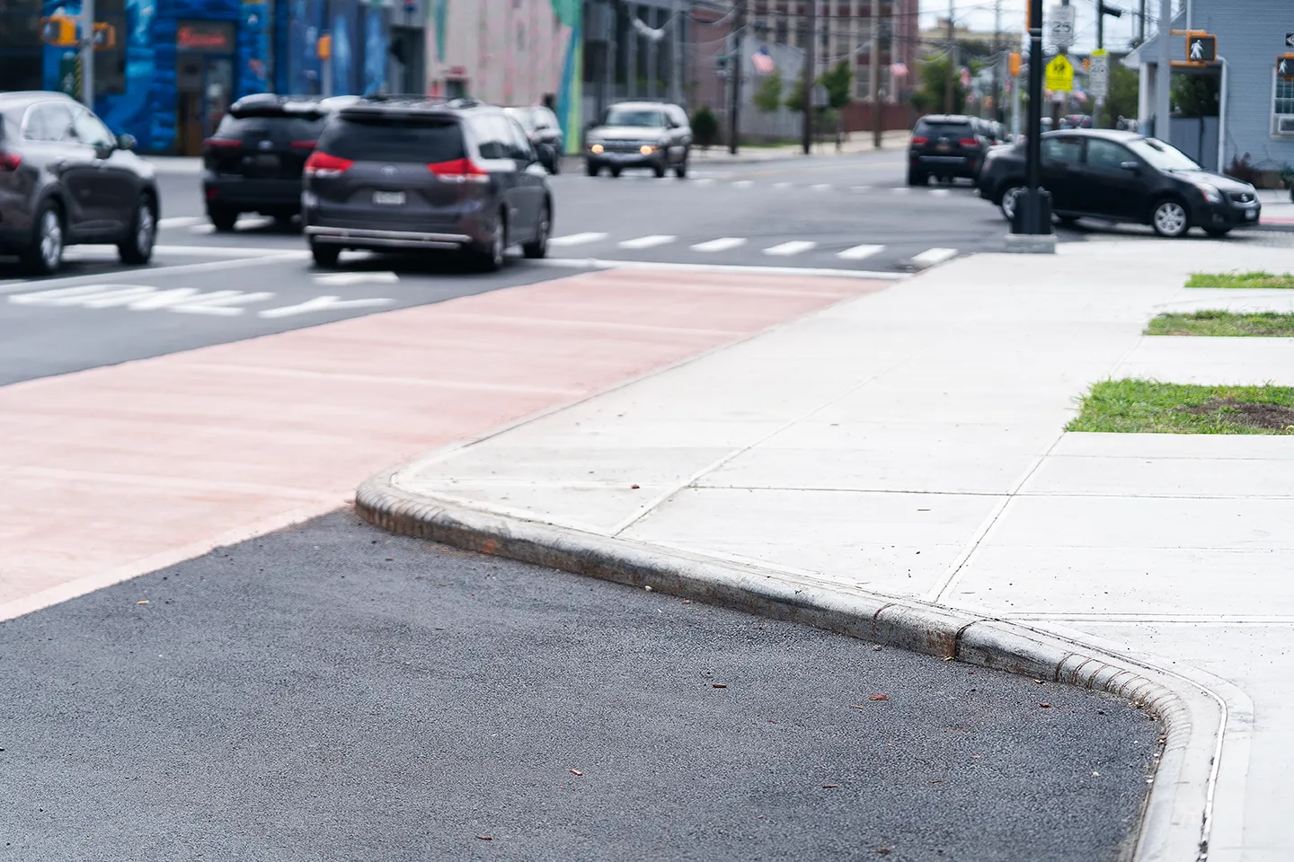 ADA-compliant curb extensions help to shorten crossing times.