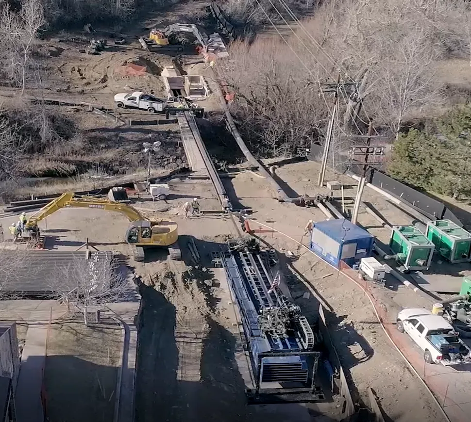 The fused high-density polyethylene (HDPE) pipe was fed into the tunnel at the western portal, with a machine set up at the eastern portal for the pull-in.
