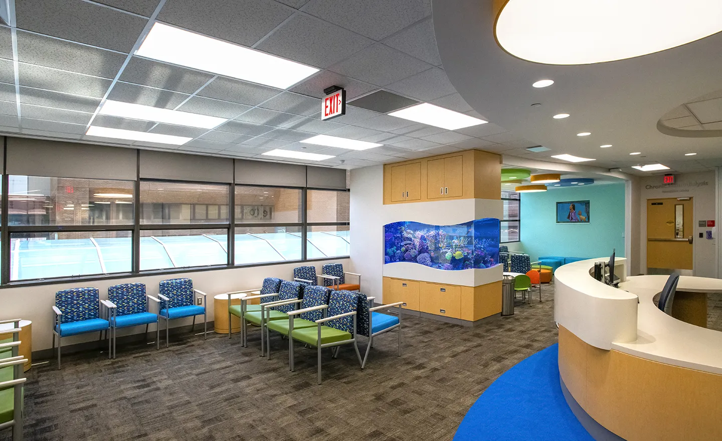Brightly colored furniture and fixtures complement the underwater theme and enhance patient experience.